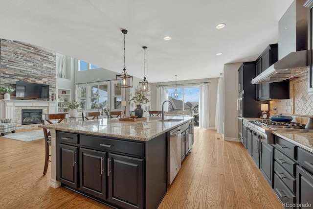 26566 E Peakview Dr, Aurora, CO 80016 - kitchen featuring a sink, appliances with stainless steel finishes, plenty of natural light, and light wood finished floors