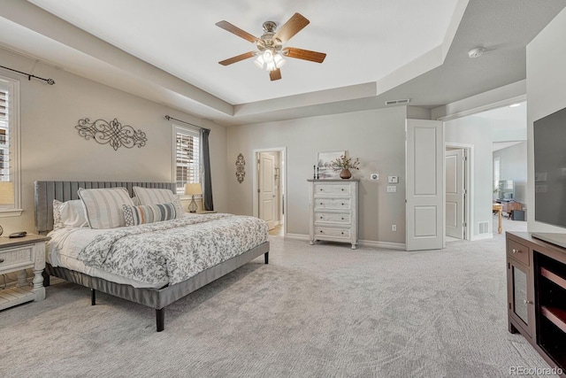 26566 E Peakview Dr, Aurora, CO 80016 - bedroom featuring light colored carpet, a raised ceiling, a ceiling fan, baseboards, and visible vents