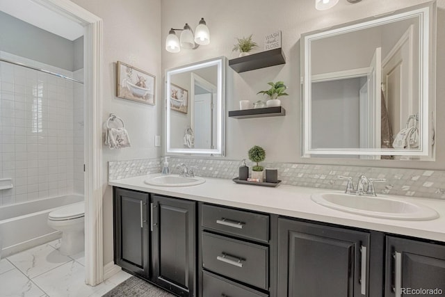 26566 E Peakview Dr, Aurora, CO 80016 - full bathroom with double vanity, toilet, a sink, and marble finish floor