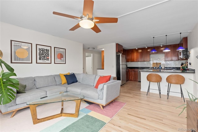 1150 Vine St Unit 306, Denver, CO 80206 - living room with track lighting, light wood-type flooring, and a ceiling fan