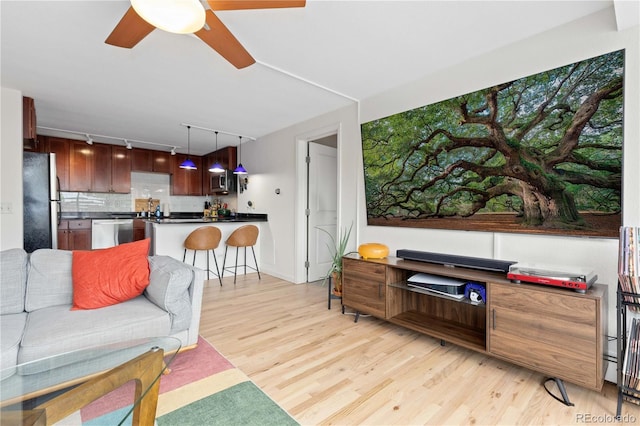 1150 Vine St Unit 306, Denver, CO 80206 - living room with track lighting, light wood-style floors, and ceiling fan