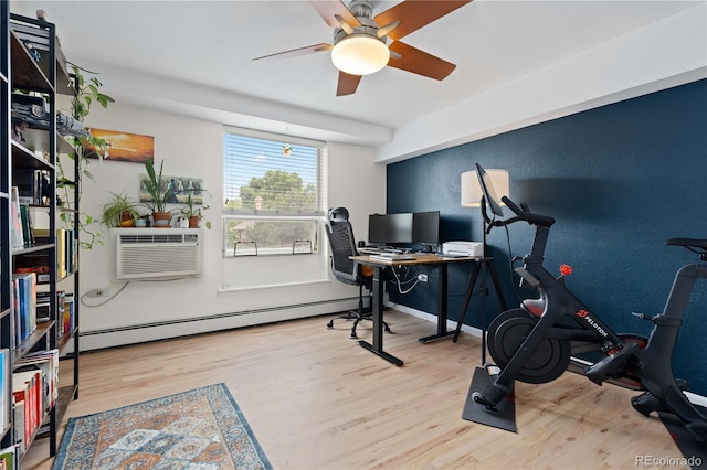 1150 Vine St Unit 306, Denver, CO 80206 - office featuring wood finished floors, ceiling fan, baseboard heating, a wall mounted air conditioner, and baseboards