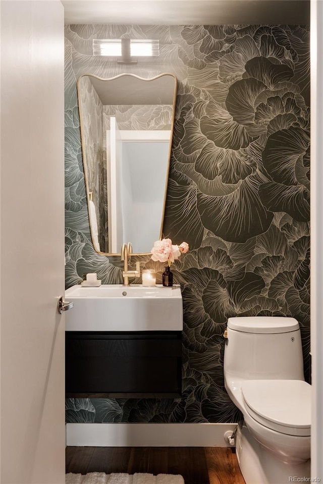 3130 Wyandot St, Denver, CO 80211 - bathroom with wallpapered walls, vanity, and toilet