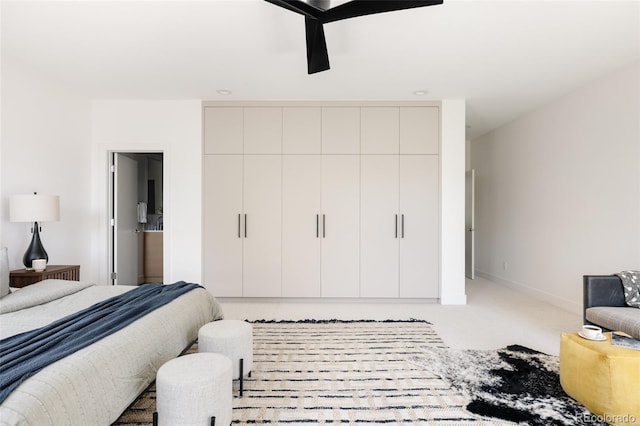 3130 Wyandot St, Denver, CO 80211 - carpeted bedroom featuring baseboards, ensuite bathroom, and a ceiling fan