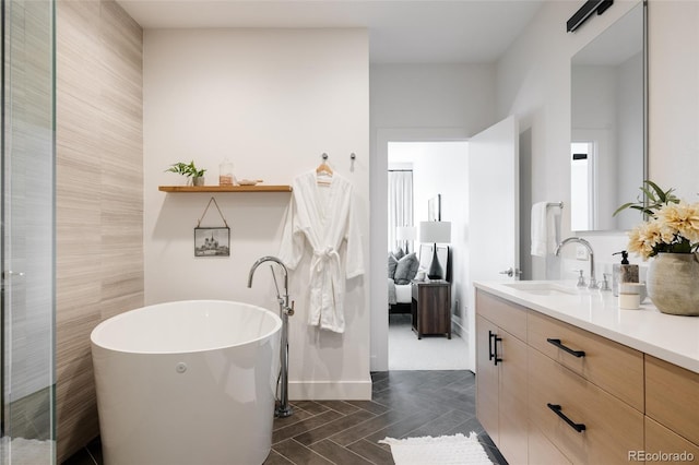 3130 Wyandot St, Denver, CO 80211 - full bathroom with vanity, a freestanding tub, and baseboards