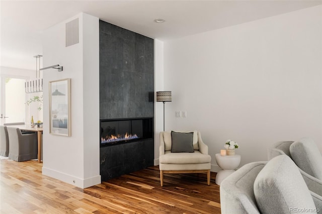 3130 Wyandot St, Denver, CO 80211 - sitting room with light wood-style floors, baseboards, and a tile fireplace