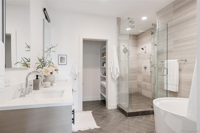3130 Wyandot St, Denver, CO 80211 - bathroom featuring a shower stall, double vanity, a freestanding tub, and recessed lighting