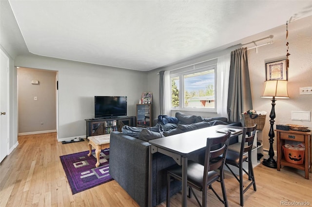 3691 Allison St, Wheat Ridge, CO 80033 - living room featuring light wood finished floors and baseboards
