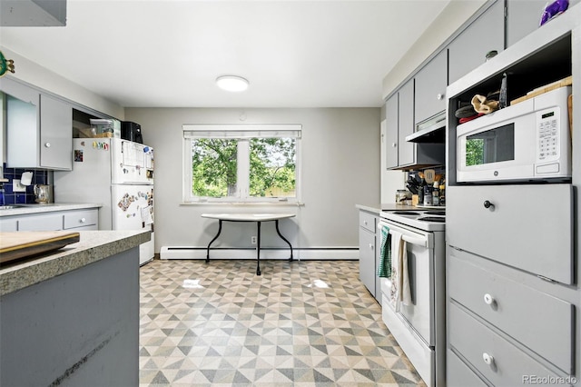 3691 Allison St, Wheat Ridge, CO 80033 - kitchen with a baseboard radiator, white appliances, light flooring, under cabinet range hood, and gray cabinetry