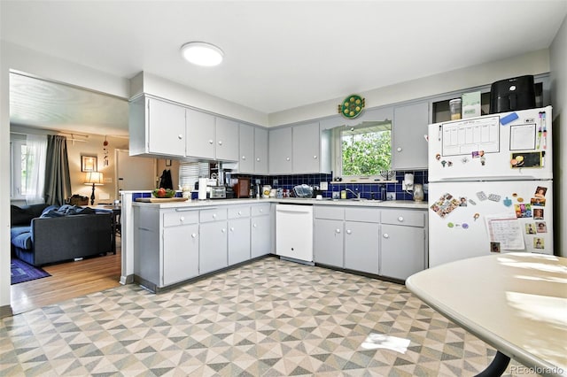 3691 Allison St, Wheat Ridge, CO 80033 - kitchen featuring white appliances, light countertops, light floors, and a sink
