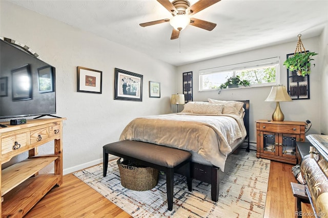 3691 Allison St, Wheat Ridge, CO 80033 - bedroom with light wood-type flooring, baseboards, and ceiling fan
