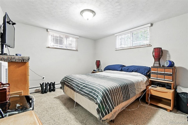 3691 Allison St, Wheat Ridge, CO 80033 - bedroom with multiple windows, a baseboard radiator, and a textured ceiling