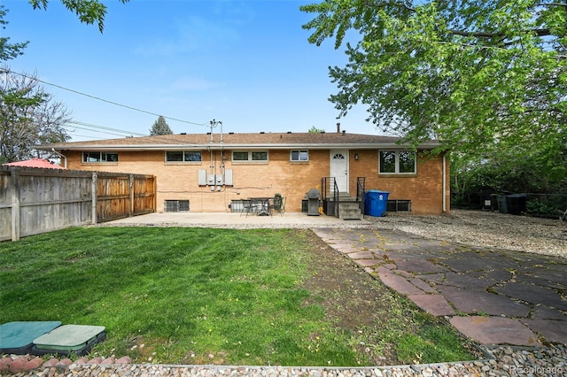 3691 Allison St, Wheat Ridge, CO 80033 - rear view of house featuring a patio area and brick siding