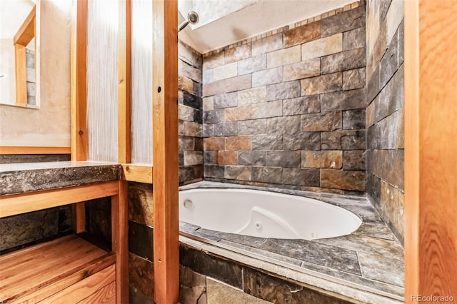 bathroom featuring tiled bath