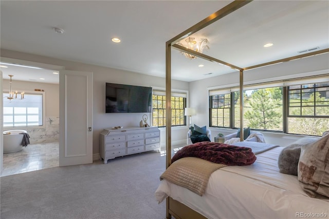 carpeted bedroom featuring multiple windows, a notable chandelier, recessed lighting, and visible vents