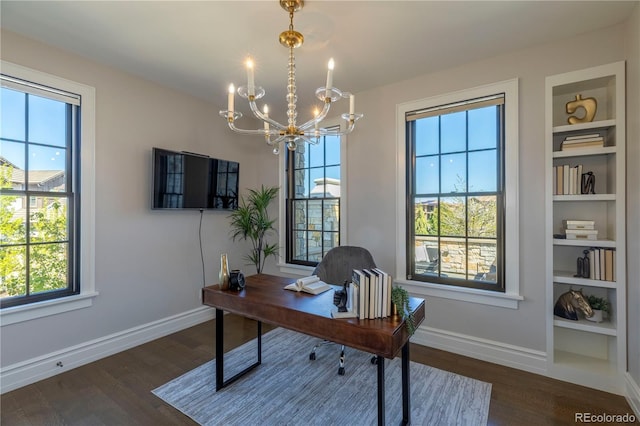 office with an inviting chandelier, baseboards, built in features, and dark wood-style floors