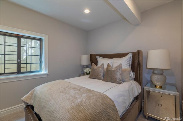 carpeted bedroom featuring recessed lighting, beamed ceiling, and baseboards