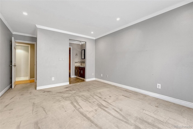 unfurnished bedroom with baseboards, connected bathroom, light colored carpet, crown molding, and recessed lighting