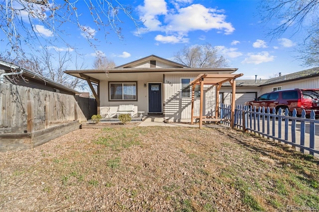 1940 Carmel Dr, Colorado Springs, CO 80910 - bungalow with a garage, a porch, fence, and a front lawn