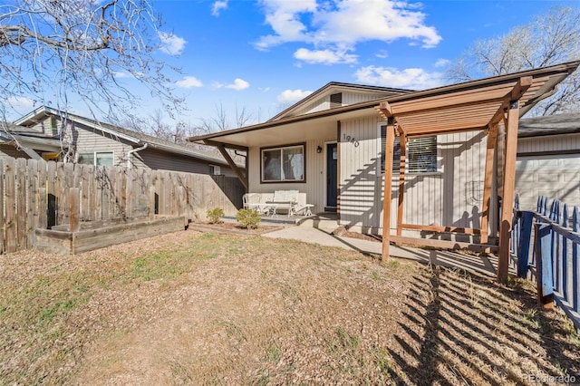 1940 Carmel Dr, Colorado Springs, CO 80910 - view of front facade featuring a patio and fence