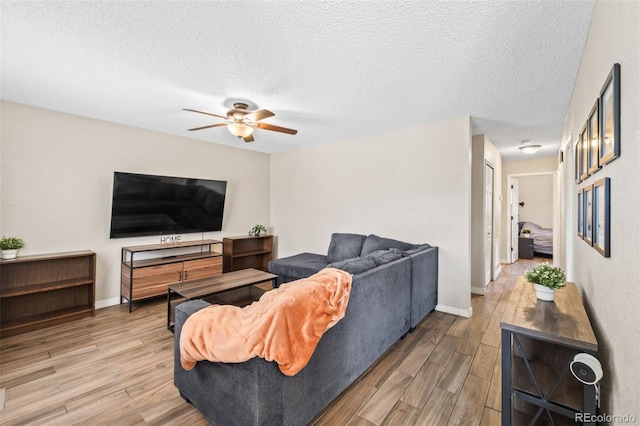 1940 Carmel Dr, Colorado Springs, CO 80910 - living area featuring baseboards, a ceiling fan, wood finished floors, and a textured ceiling