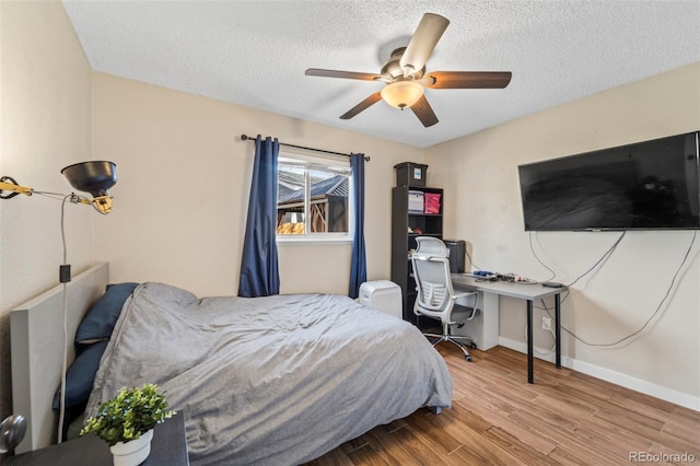 1940 Carmel Dr, Colorado Springs, CO 80910 - bedroom with a textured ceiling, wood finished floors, baseboards, and a ceiling fan