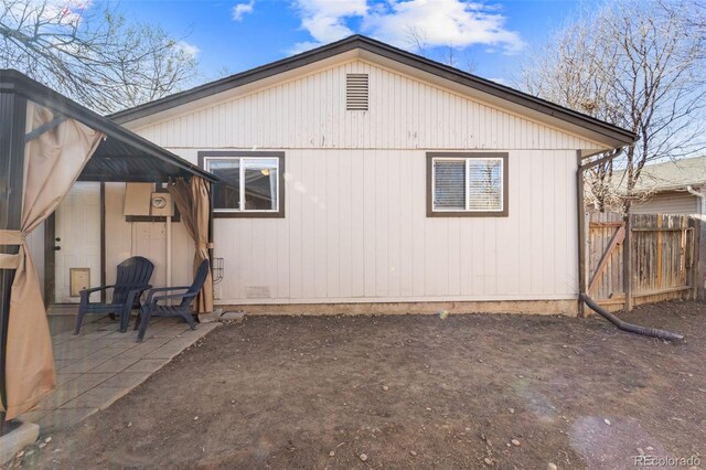 1940 Carmel Dr, Colorado Springs, CO 80910 - back of property with a patio and fence