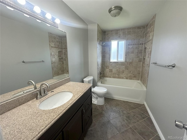 full bath with vanity, bathing tub / shower combination, toilet, and baseboards