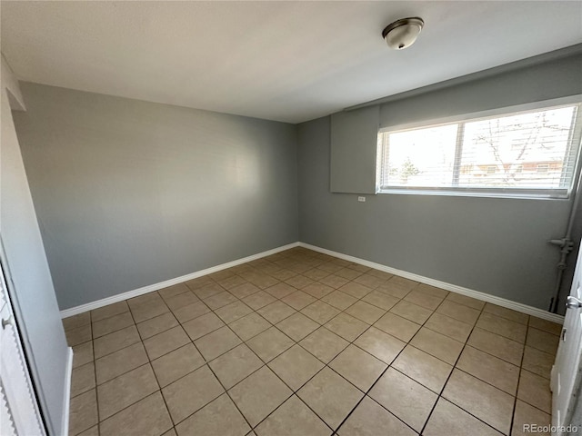 empty room featuring baseboards