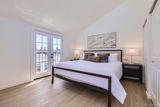 2120 W 31st Ave, Denver, CO 80211 - bedroom featuring french doors, baseboards, vaulted ceiling, wood finished floors, and access to exterior