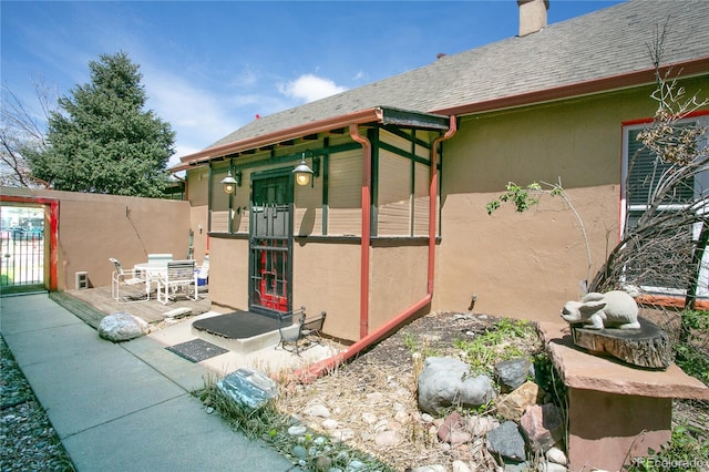 view of side of property with a patio area