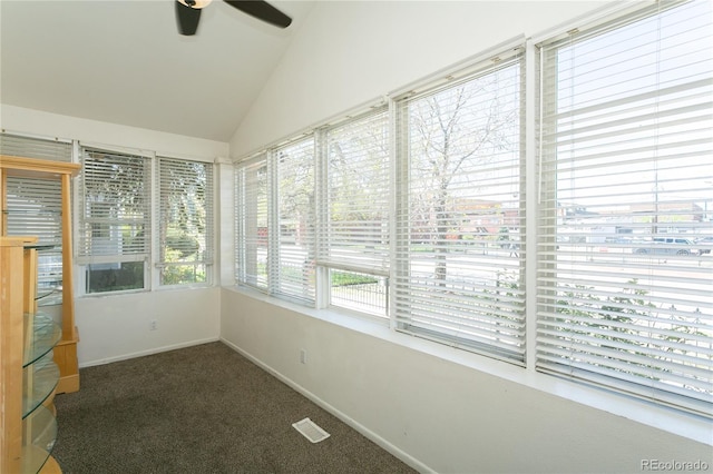 unfurnished sunroom featuring ceiling fan and lofted ceiling