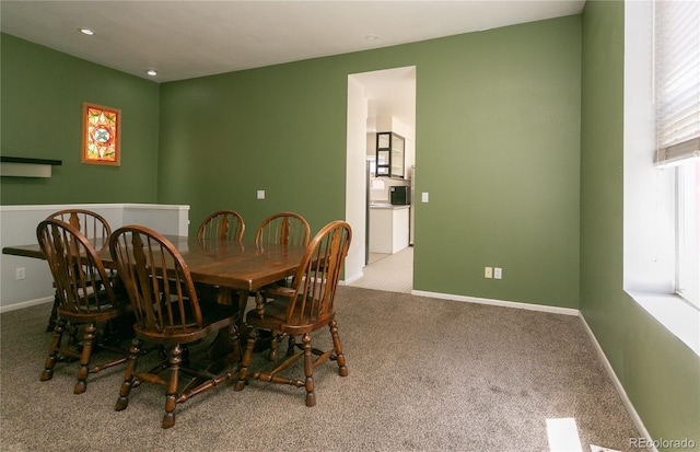 dining space with carpet flooring