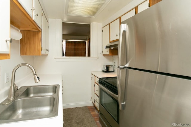 kitchen featuring sink, white cabinets, stainless steel appliances, and ventilation hood