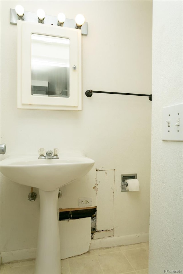 bathroom featuring tile patterned floors and sink