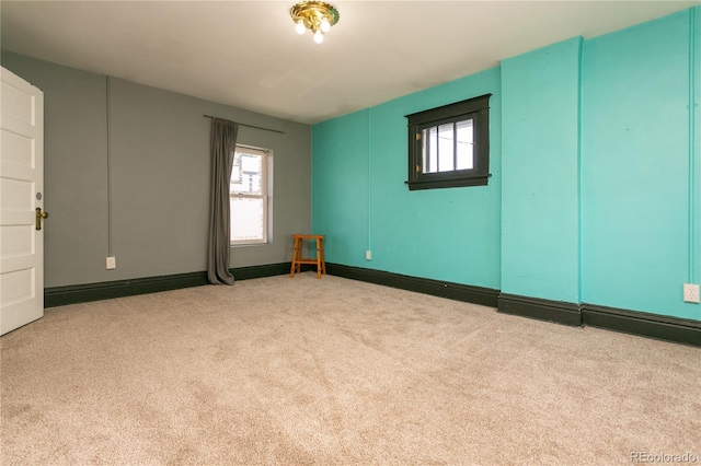 empty room featuring light colored carpet