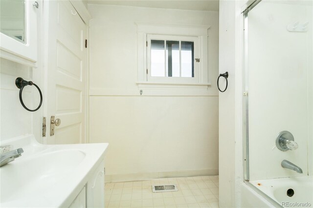 bathroom featuring vanity and shower / bathtub combination