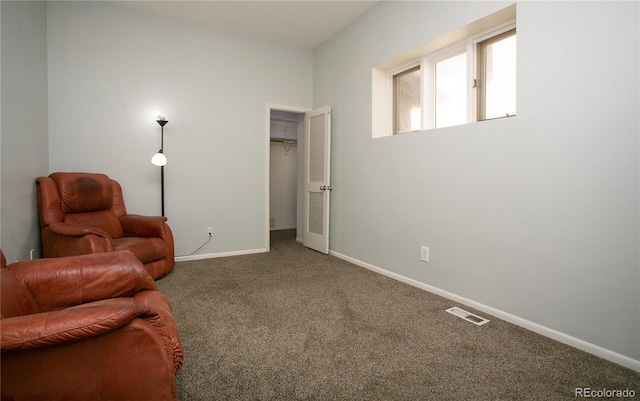 sitting room featuring carpet floors