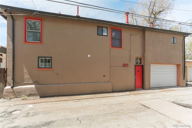 view of side of home with a garage