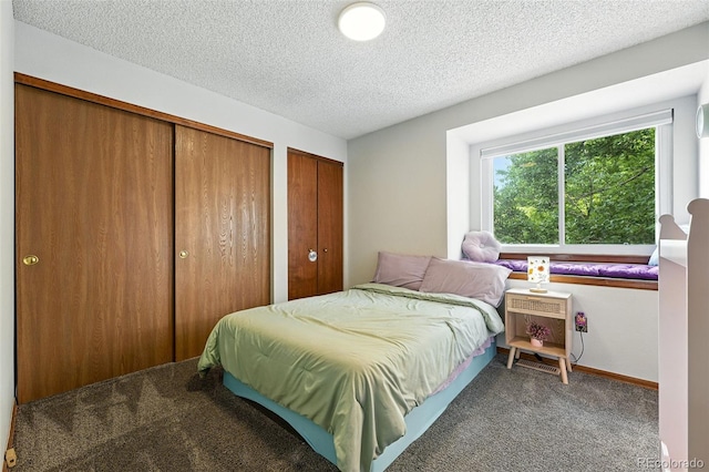 8468 S Upham Way, Littleton, CO 80128 - carpeted bedroom with two closets and a textured ceiling
