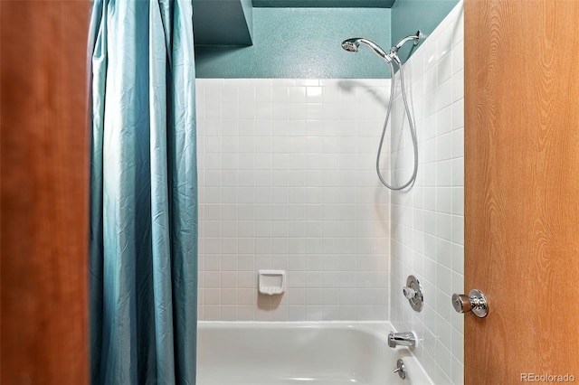 8468 S Upham Way, Littleton, CO 80128 - bathroom featuring shower / bath combination with curtain