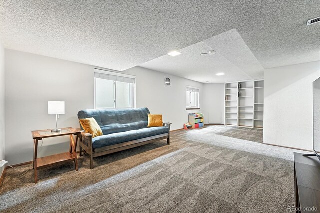 8468 S Upham Way, Littleton, CO 80128 - living area with carpet floors and a textured ceiling