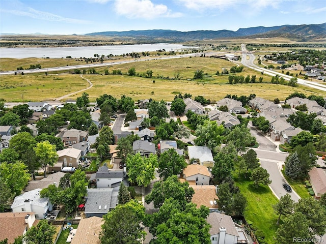 8468 S Upham Way, Littleton, CO 80128 - aerial view of residential area with a water and mountain view