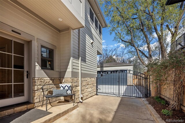 exterior space with fence and an outbuilding
