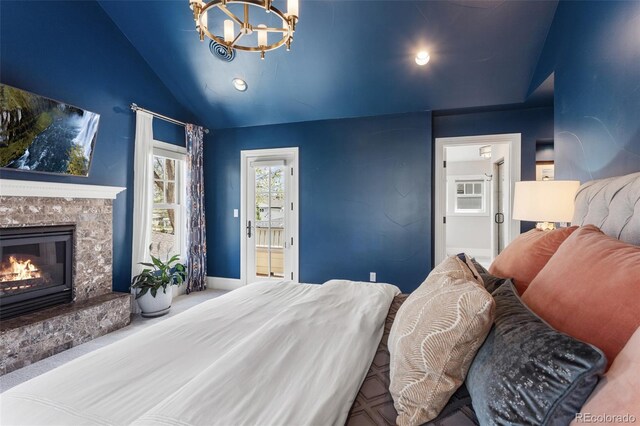 bedroom with an inviting chandelier, a glass covered fireplace, recessed lighting, baseboards, and vaulted ceiling