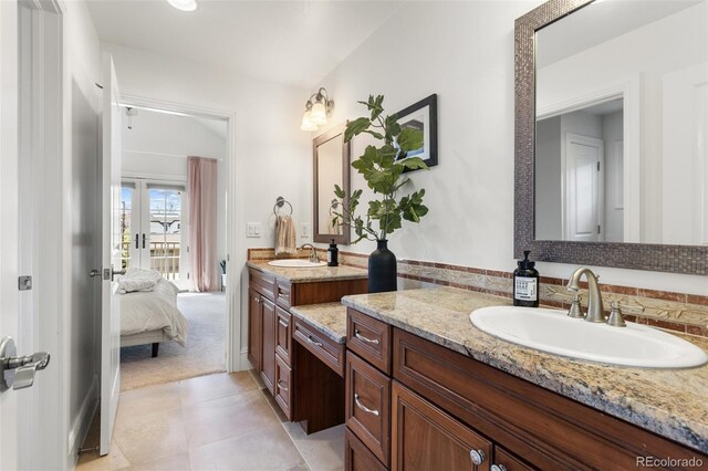 ensuite bathroom featuring french doors, ensuite bath, tile patterned floors, and vanity