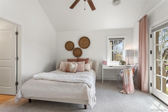 bedroom featuring ceiling fan, vaulted ceiling, light carpet, and visible vents