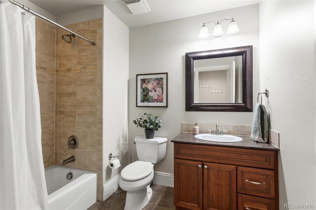 full bathroom with visible vents, shower / tub combo, vanity, baseboards, and toilet