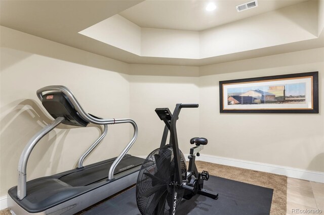 workout area featuring baseboards and visible vents
