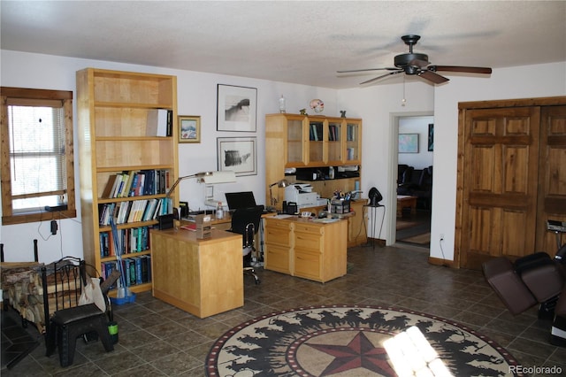 office space featuring a textured ceiling and ceiling fan